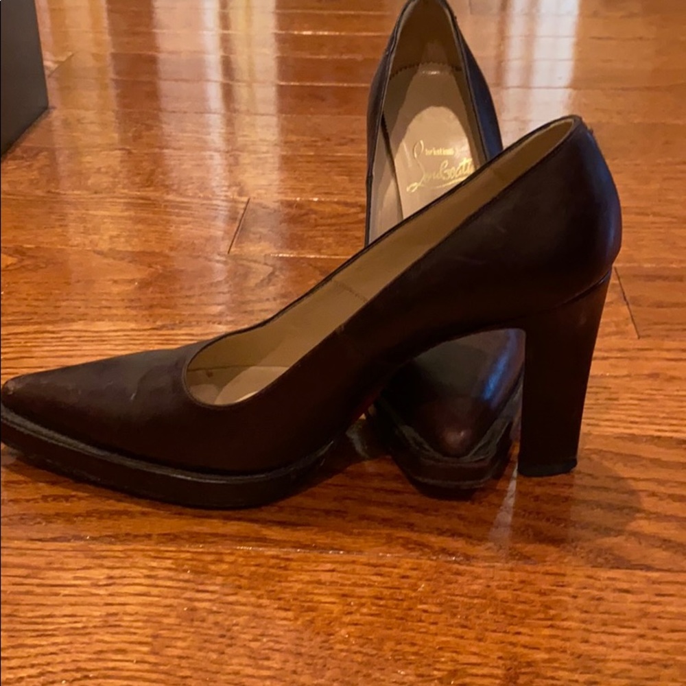 Brown vintage Christian Louboutin shoes.